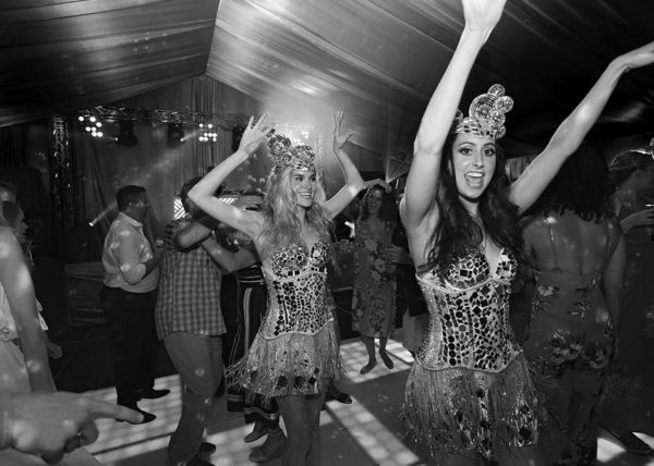 Dancers in silver corsets rocking up the party