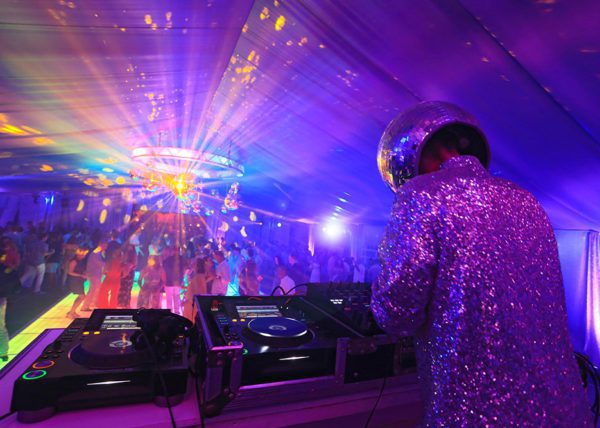 The coolest DJ at the turntable with a glittering suit and disco mirror ball for a head!