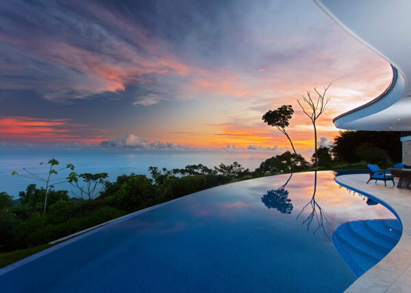 Infinity pool enhanced by majestic sunset - Casa de Luz | Costa Verde Estates