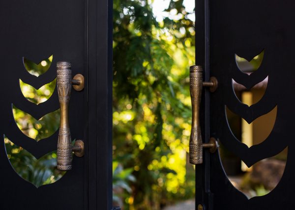 The balinese doorknob finishings and the idea of every gate being a threshold to either a fairy forest or a secret garden creates a sense of anticipation and excitement, making the entire experience truly magical. - Casa Citrina | MU Estate