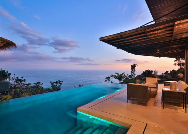 An infinity pool that merges into the horizon, ocean or sky. This design feature gives the impression that the water is flowing seamlessly and also creates the illusion of being floating into the landscape. - Casa Citrina | MU Estate